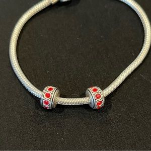 Chamilia red birthstone July wheel bead. Sterling silver - set of 2